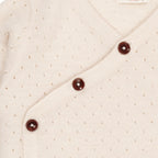 Merino crossover cardigan with hole pattern