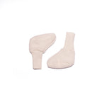 Cosilana baby booties in organic wool fleece and organic cotton in Natural on a white background
