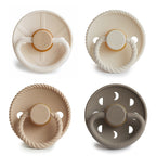 Frigg 4-pack pacifiers in latex in Crystal Sparkle on a white background