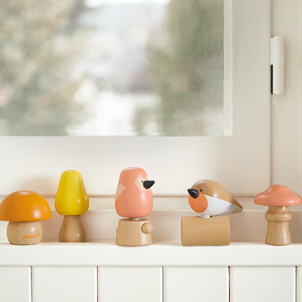 Janod WWF wooden screw toys birds and mushrooms styled in a windowsill