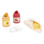 Accessories of Janod's wooden bread toaster toy for role play on a white background