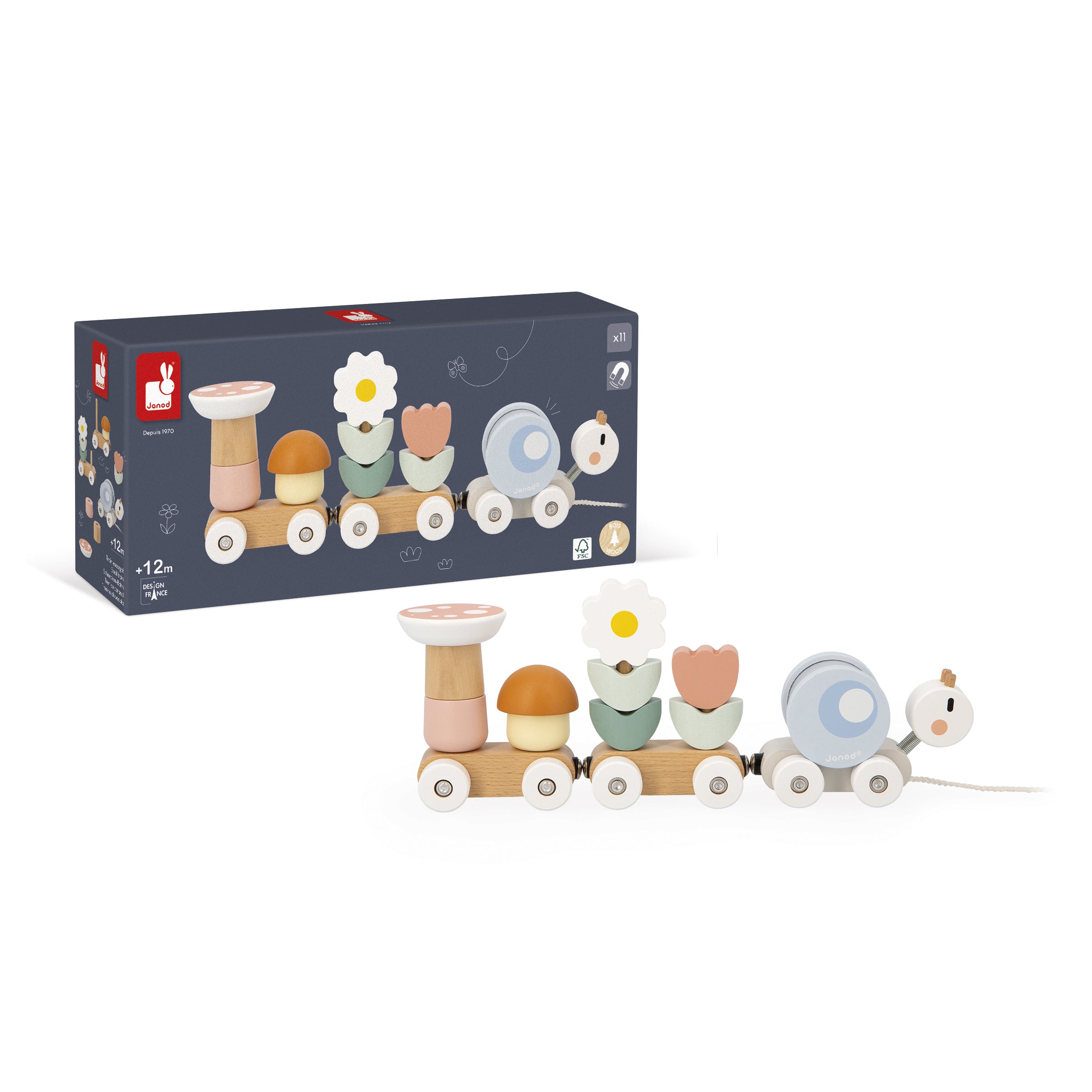 Child playing with Janod Pull along snail in front of original packaging