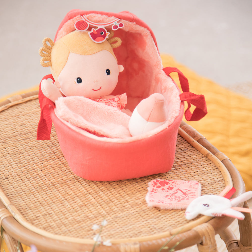 Lilliputiens Baby playset Lena styled on a rotan surface