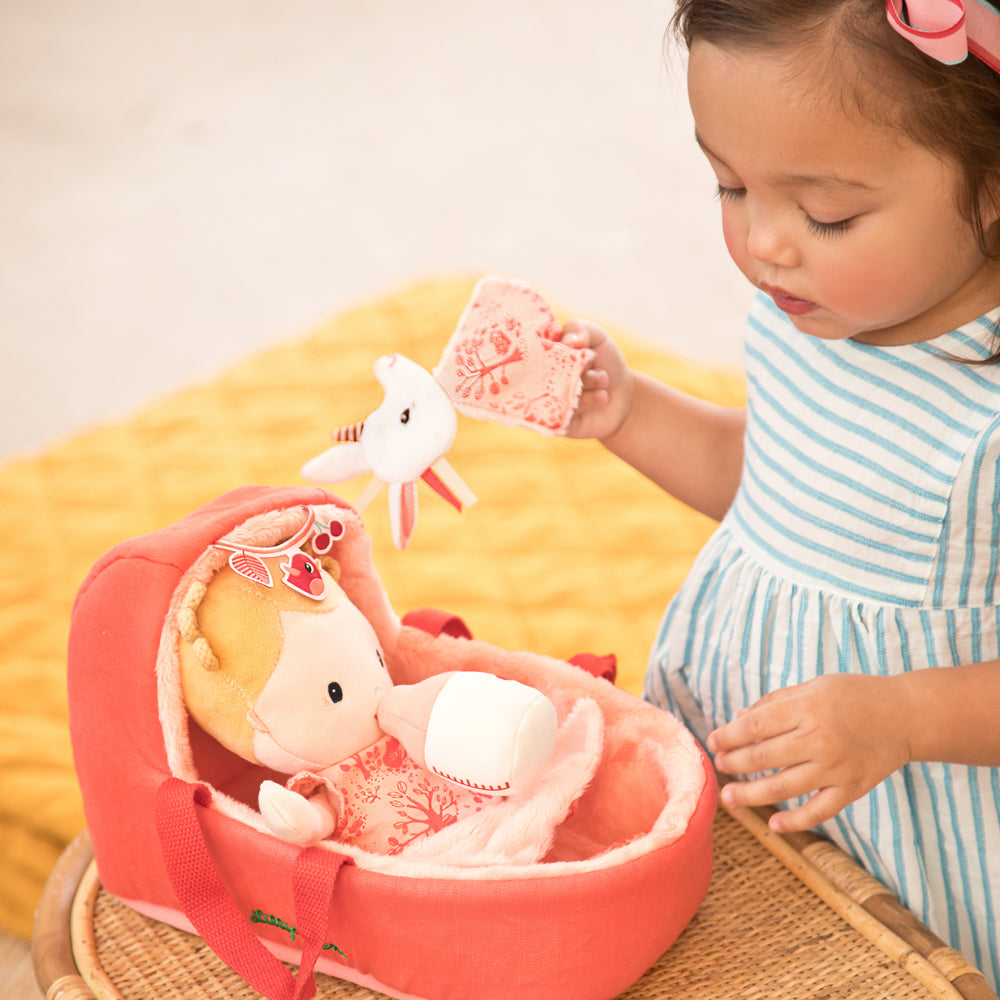 Child playing with a Lilliputiens Baby playset Lena
