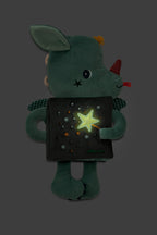 Lilliputiens Joe the dragon cuddle activity book featuring a glowing star design on a dark background
