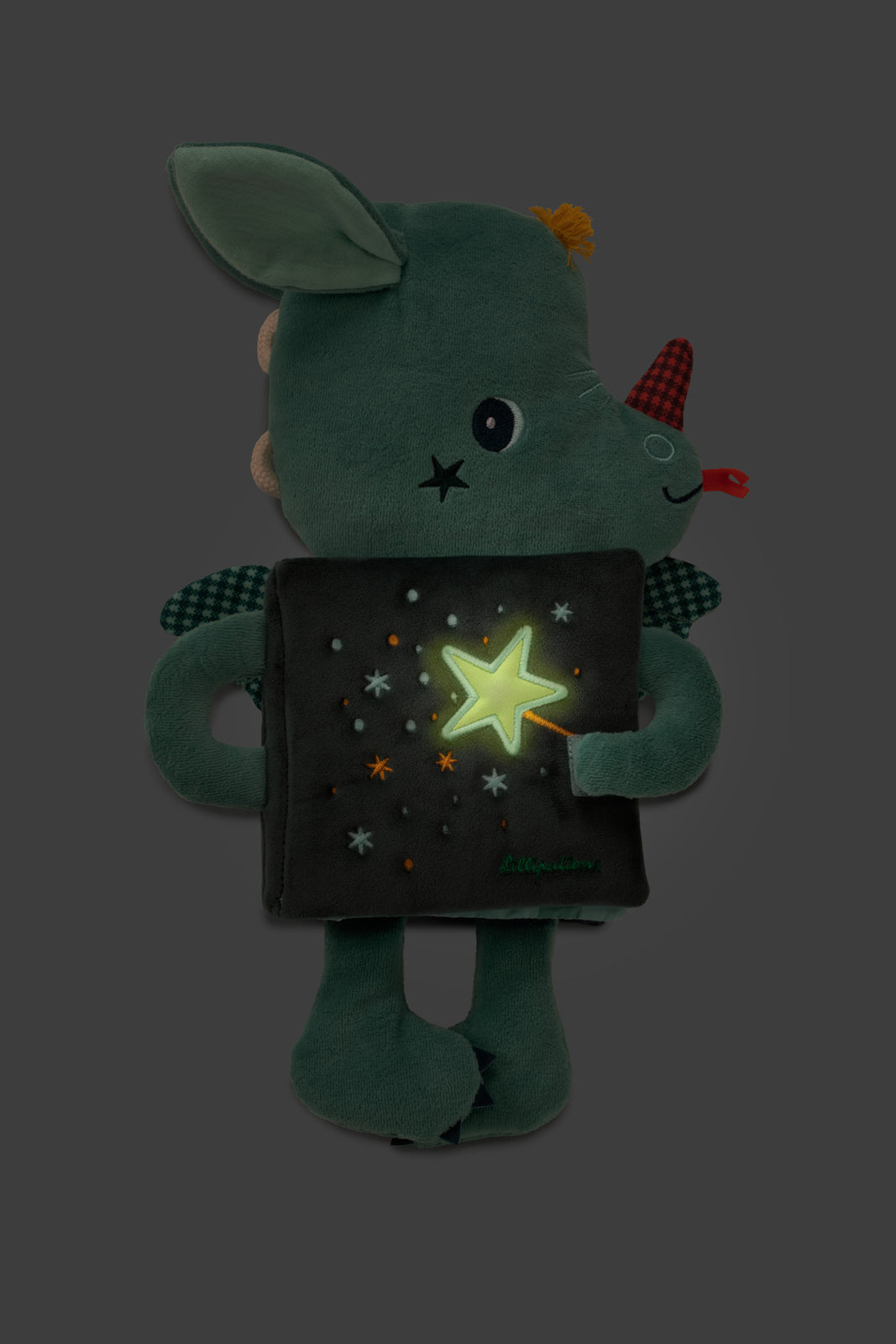 Lilliputiens Joe the dragon cuddle activity book featuring a glowing star design on a dark background