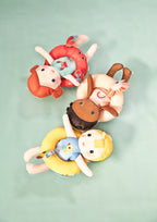 Lilliputiens bath doll crab floating with other bath dolls in water