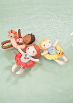 Lilliputiens bath doll unicorn floating with other bath dolls