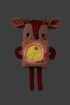 Lilliputiens Stella the Fawn cuddle toy featuring a glowing leave on a dark background