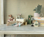 Maileg Big Sister Mouse in matchbox bed styled with doll furniture, other mice and a plush rhino