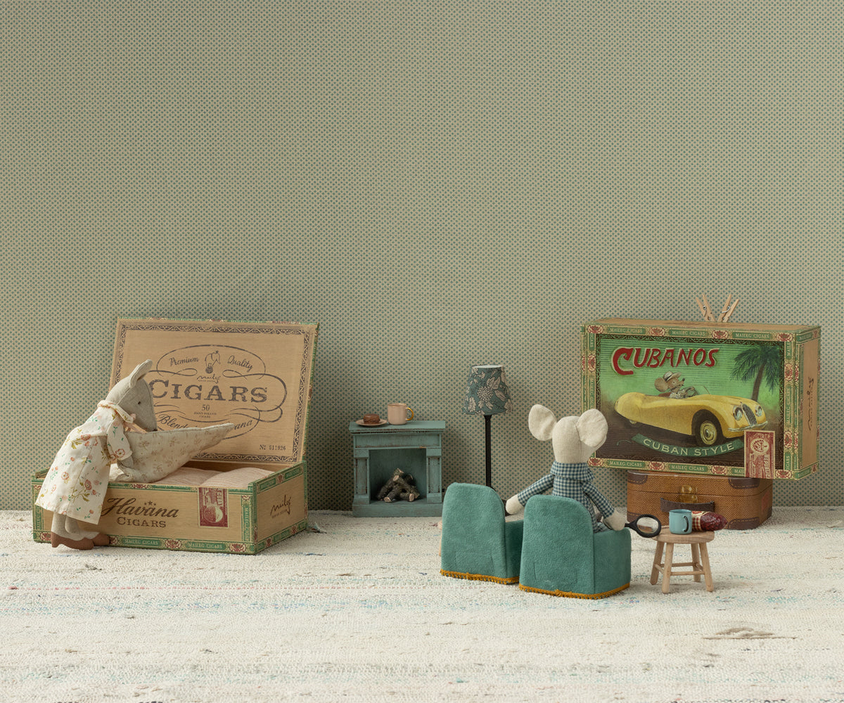 Maileg Grandma and Grandpa Mice in cigar box styled in a doll living room setting
