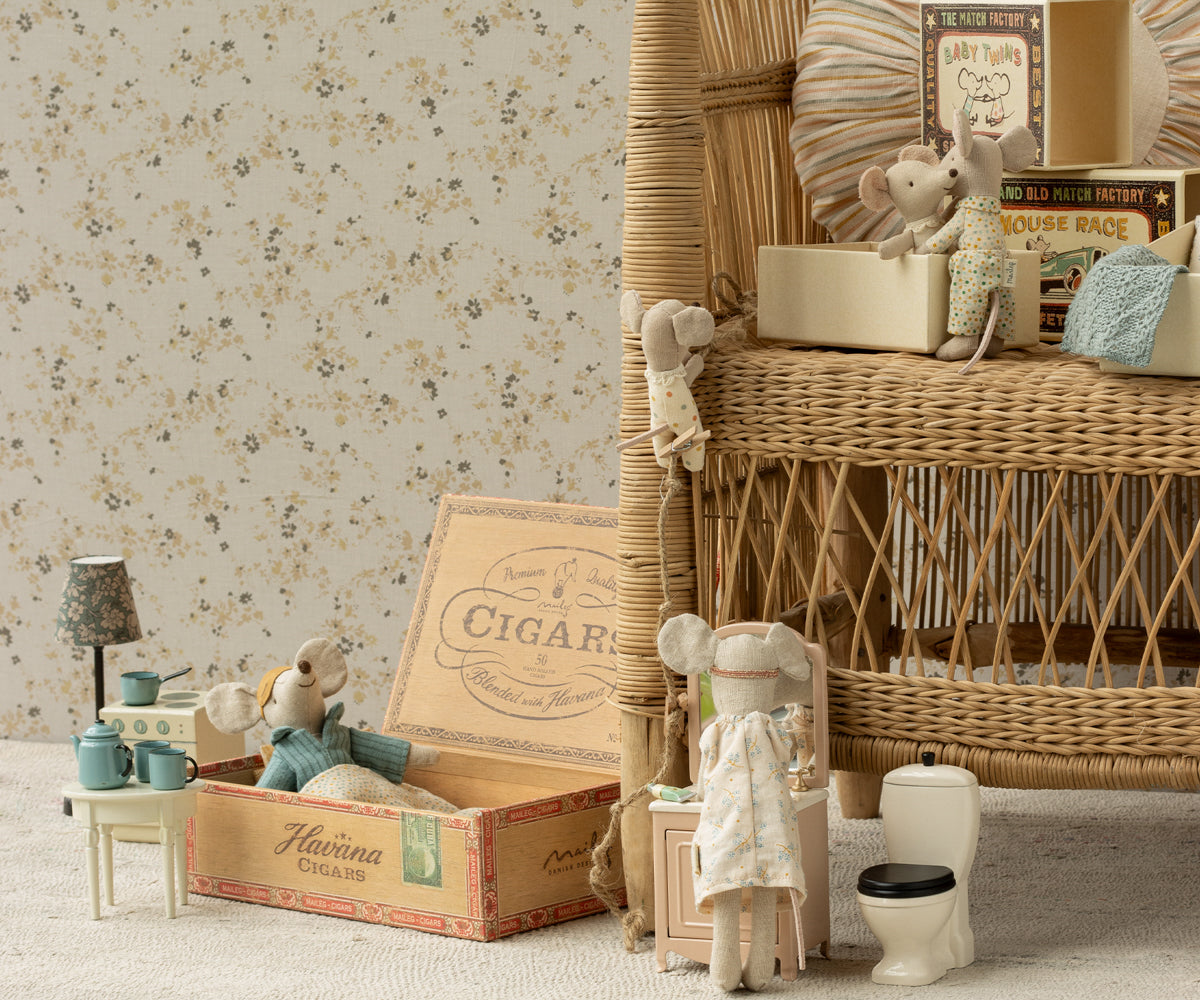 Maileg Little Brother Mouse in matchbox with polka dot pyjamas styled in a children's room with other toy mice and doll furniture (not included)