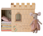 Maileg Princess and the Pea big sister mouse next to cardboard castle with stacked mattresses