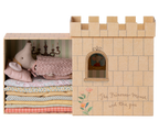 Maileg Princess and the Pea big sister mouse sleeping on stacked mattresses inside cardboard castle