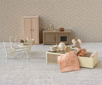 Lifestyle image of Maileg Princess Mouse Little Sister styled in a doll living room