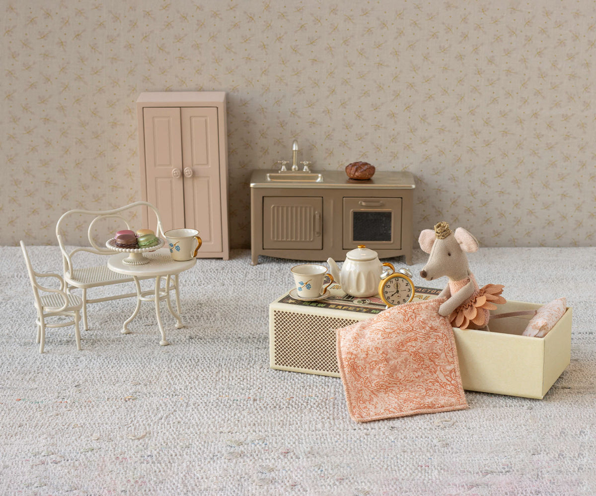 Lifestyle image of Maileg Princess Mouse Little Sister styled in a doll living room