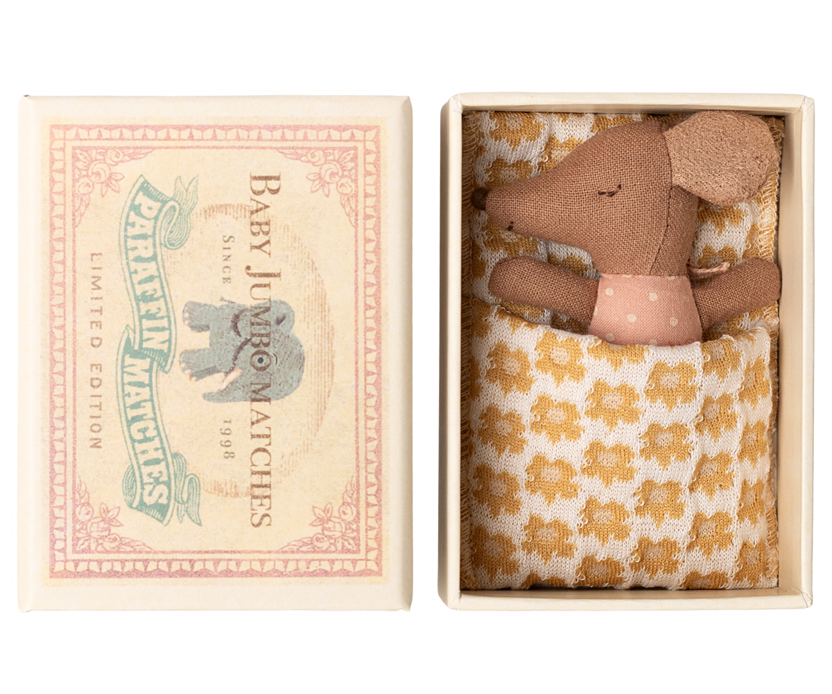 Maileg Sleepy Wakey Baby Mouse in matchbox sleeping in rose-spotted outfit with head turned to left