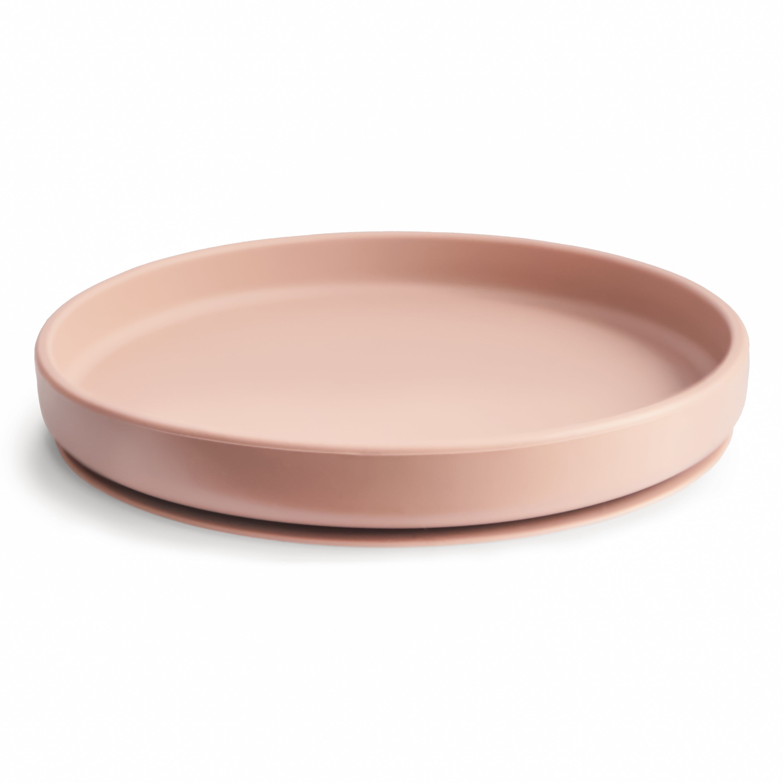 Side view of a Mushie classic silicone suction plate in Blush on a white background