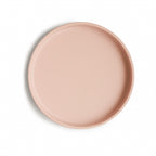 Top view of a Mushie classic silicone suction plate in Blush on a white background