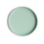 Top view of a Mushie classic silicone suction plate in Cambridge blue on a white background