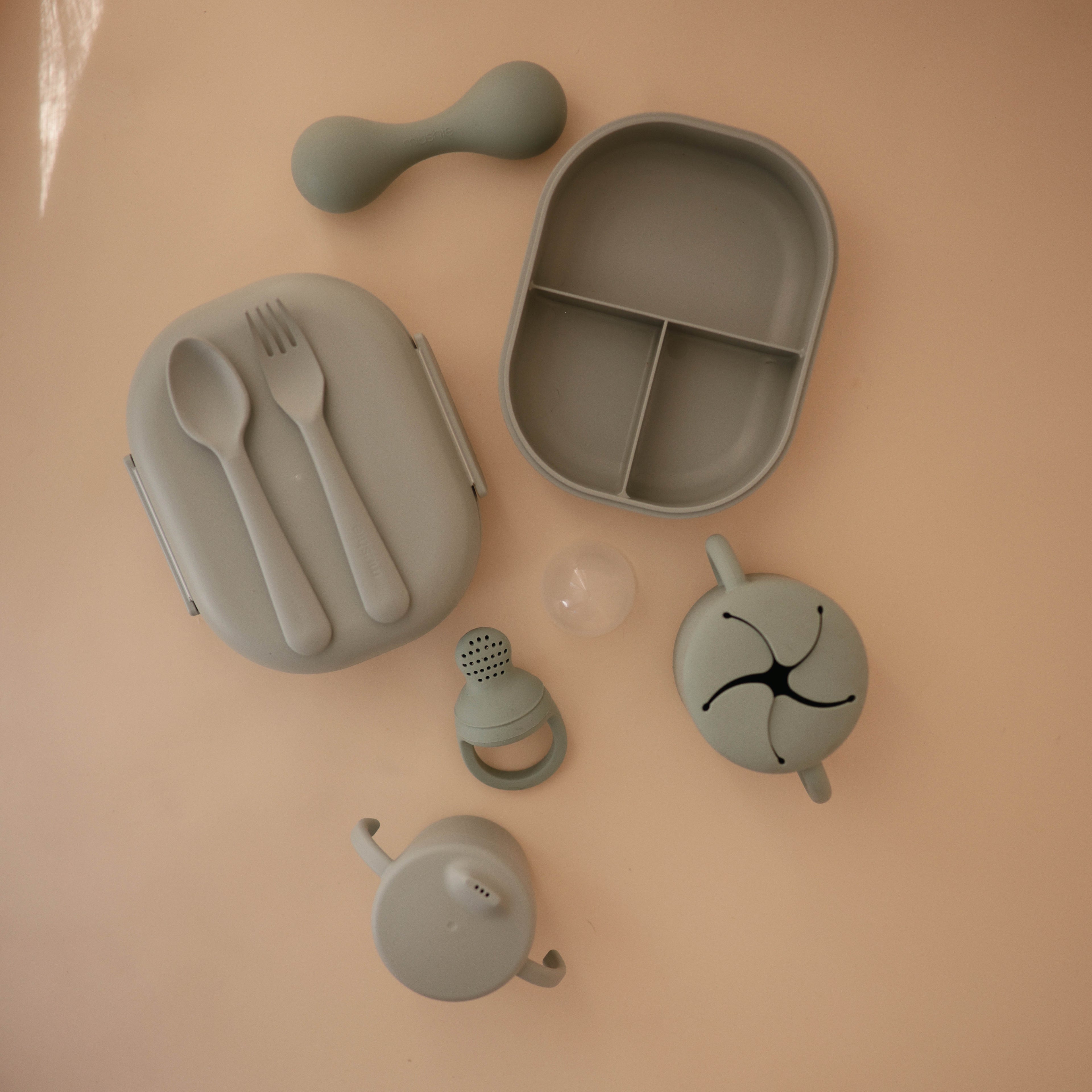 Mushie lunchbox in Blush styled with feeding accessories