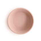 Top view of Mushie silicone suction bowl in Blush on a white background