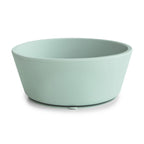 Side view of a Mushie silicone suction bowl in Cambridge blue on a white background