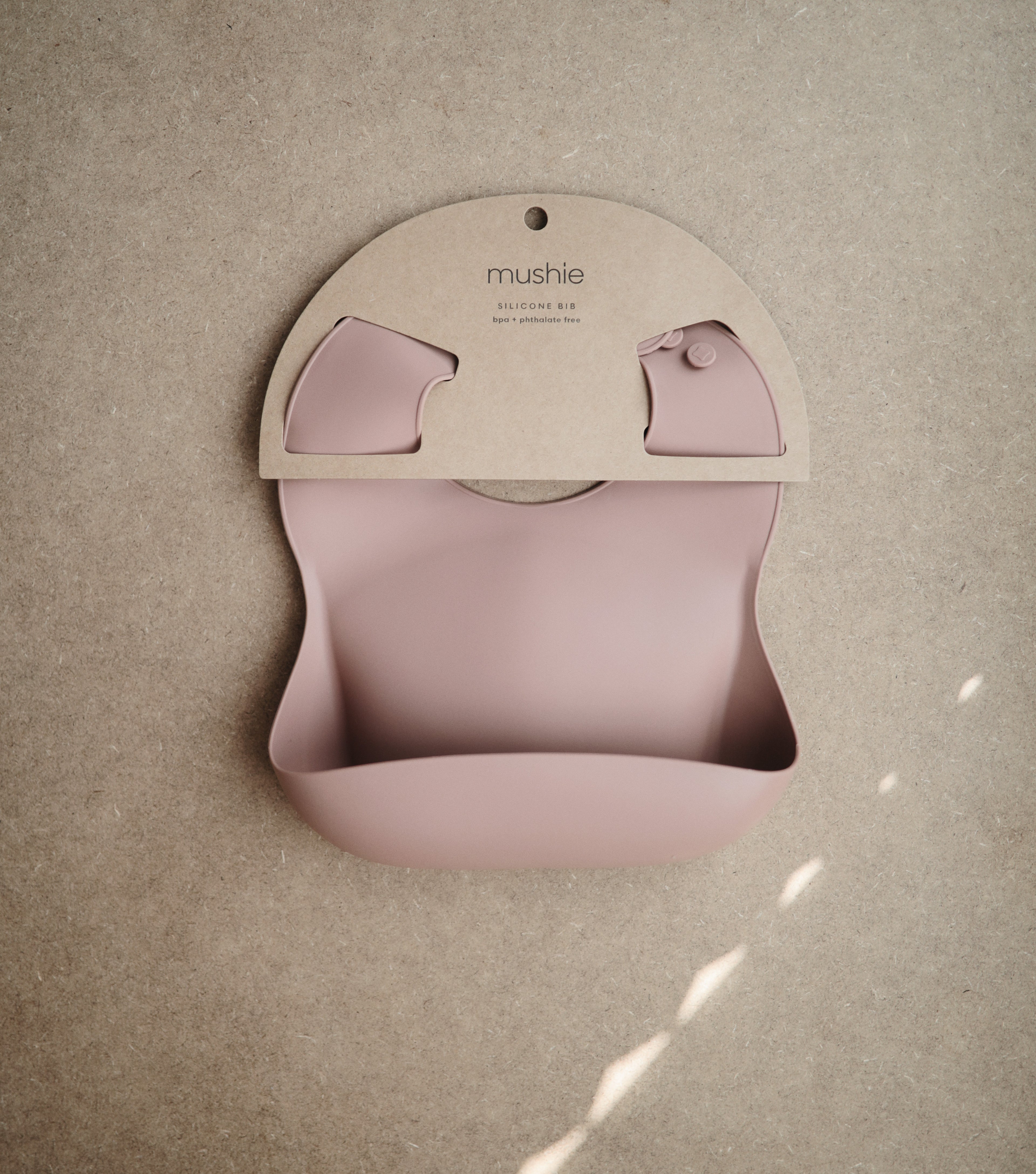Mushie silicone bib in Blush in original packaging