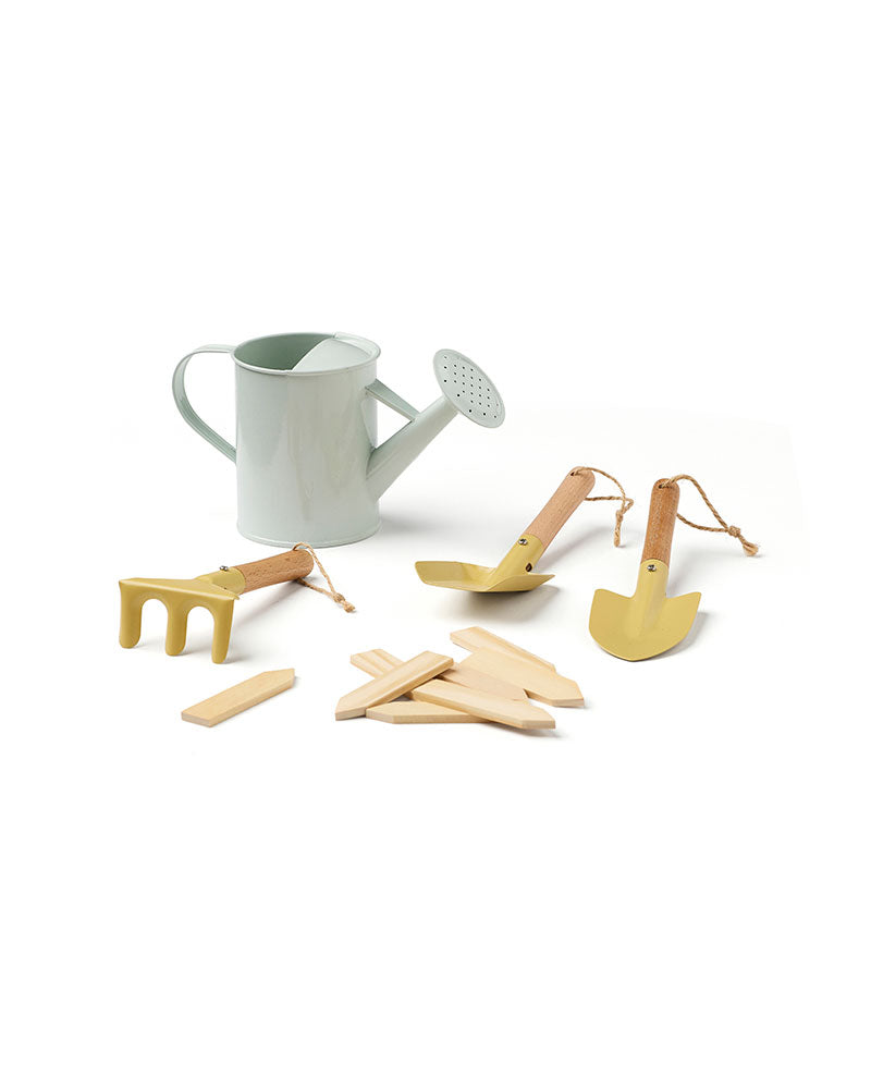 Accessories of a Kid's Concept gardening tool set for kids on a white background