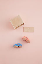 Kids Concept cars with garage play set on a pink background