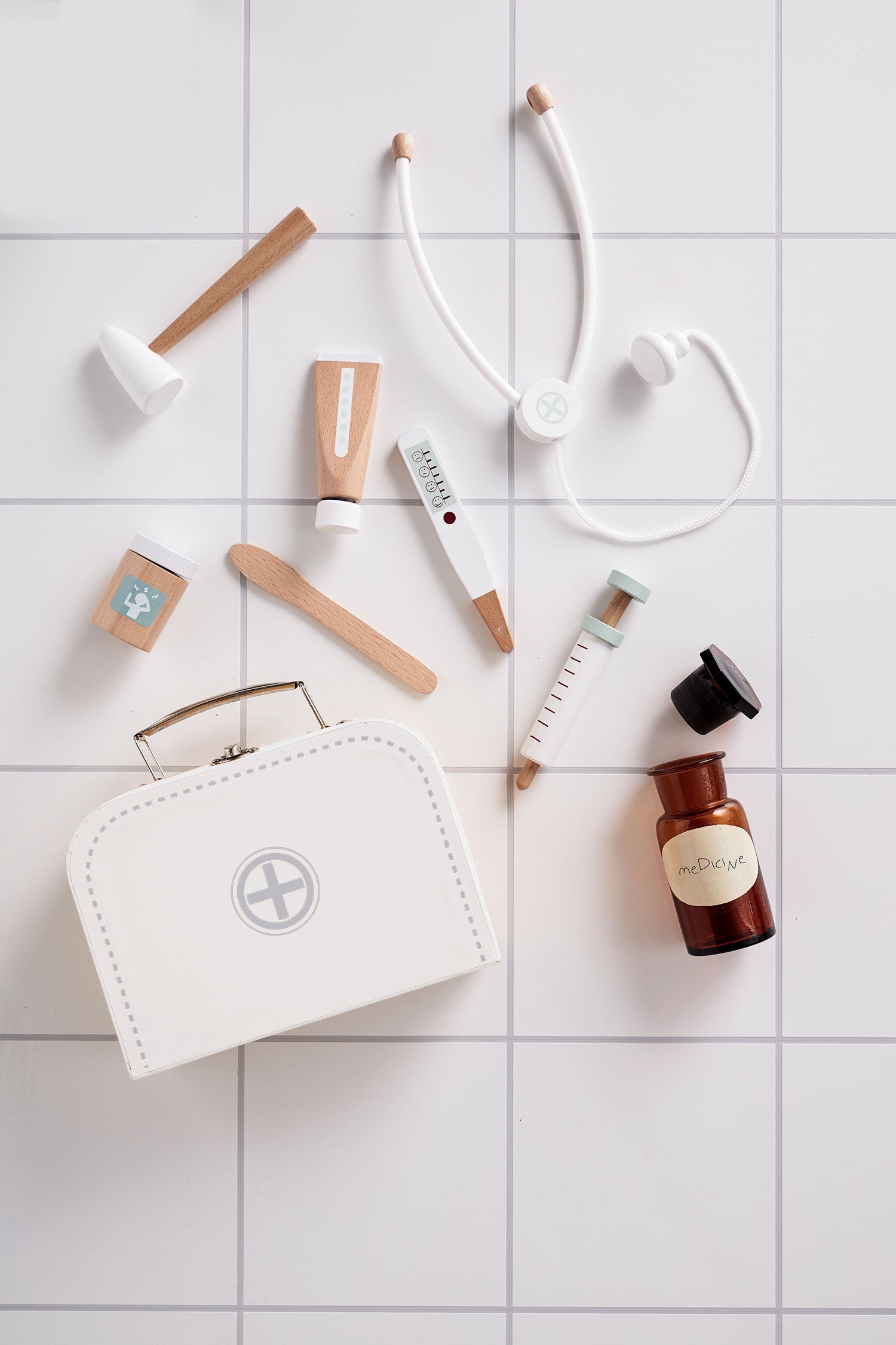 Kid's Concept doctor’s case play set in white on a tiled surface