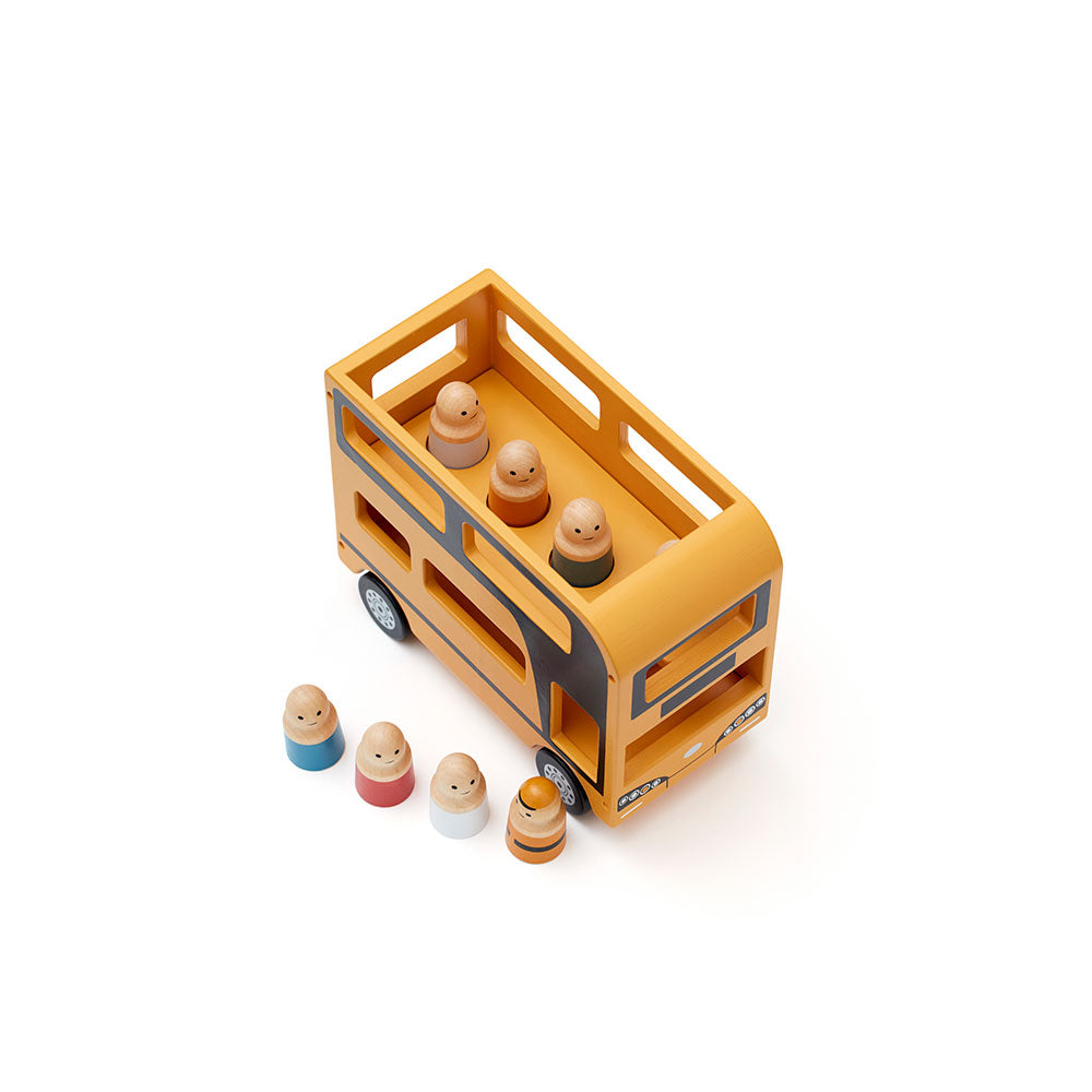 Top view of a Kid's Concept wooden double decker bus toy with figures on a white background