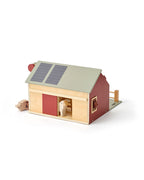 Kid's Concept wooden farmhouse toy on a white background