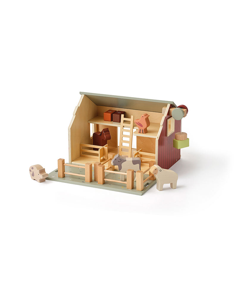Kid's Concept wooden farmhouse toy on a white background