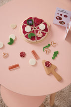 Kids Concept pizza play kit on a pink table