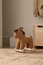 Kid's Concept pull-along horse Vera on a wooden floor in a room