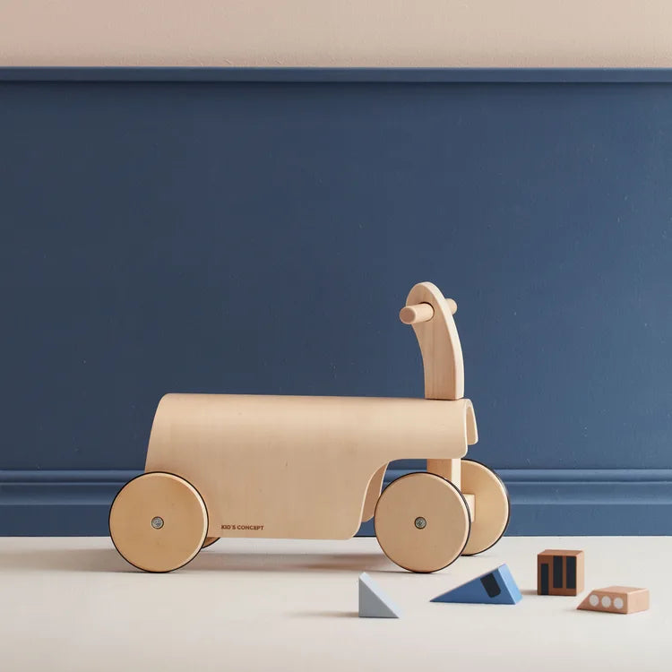 Kid's Concept ride-along kart on a blue background