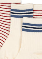 Close-up of the Konges Sløjd 2-pack Act Socks in Off White on a white background.