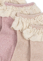 Close-up of Konges Sløjd Glitter frill socks on a white background