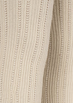 Close-up of the Konges Sløjd Bow 2-pack Pointelle Tights in Bordeaux/ Off white on a white background.