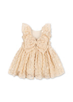 Back view of the Konges Sløjd Ally dress in Sandshell on a white background