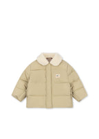 Front view of the Konges Sløjd Alpi Collar jacket in Pale Olive Green on a white background