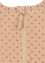 Close-ip of the zipper of the Konges Sløjd Amandine swim onesie in Emboldened not on a white background