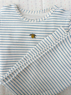 Close-up of Konges Sløjd basic blouse in Stripe Bluie fabric