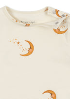 Close-up of the collar of the Konges Sløjd Basic long-sleeve body in moon print on a white background.