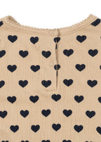 Close-up of Konges Sløjd Chleo romper in Coeur eclipse fabric