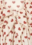 Close-up of a detail of the Konges Sløjd Cianna bow dress in Amour rouge