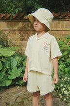 Child wearing the Konges Sløjd Coco shorts in an outdoor setting