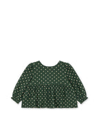 Front view of the Konges Sløjd Elin bow blouse in Dot Marseille on a white background.