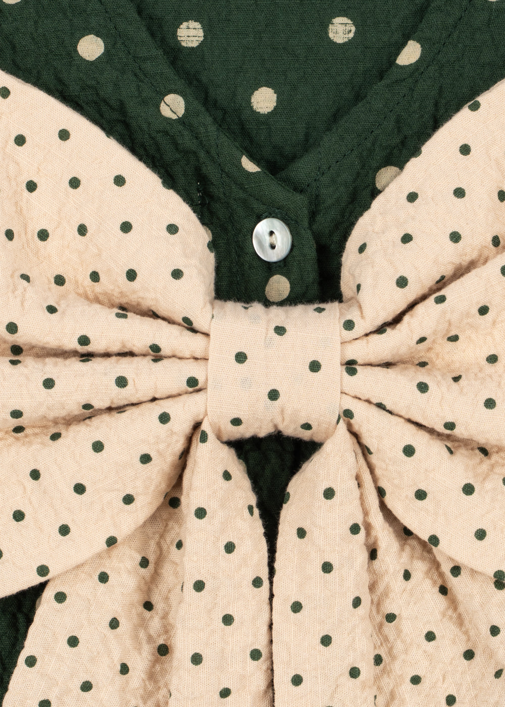 Close-up of the Konges Sløjd Elin bow blouse in Dot Marseille.